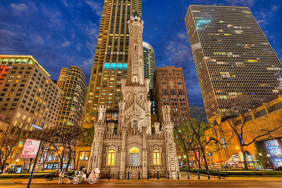 The Chicago Water Tower at Night with a Horse Carriage